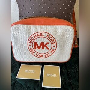 BARELY USED …… MICHAEL KORS ORANGE & OFF WHITE CANVAS and LEATHER CROSSBODY